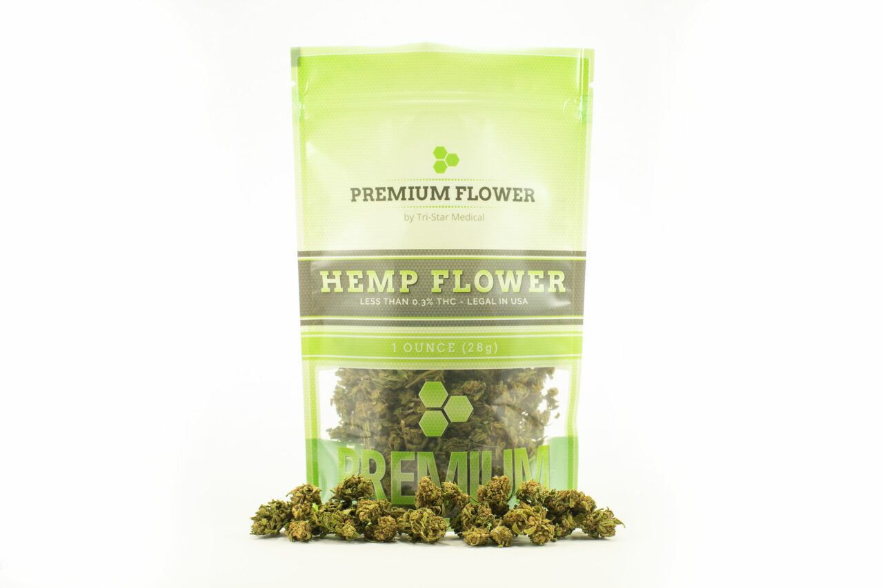 Premium Flower by Tri-Star Medical. Image of 1oz branded back filled with premium hemp flower. Hemp flower pictured in front of bag too.