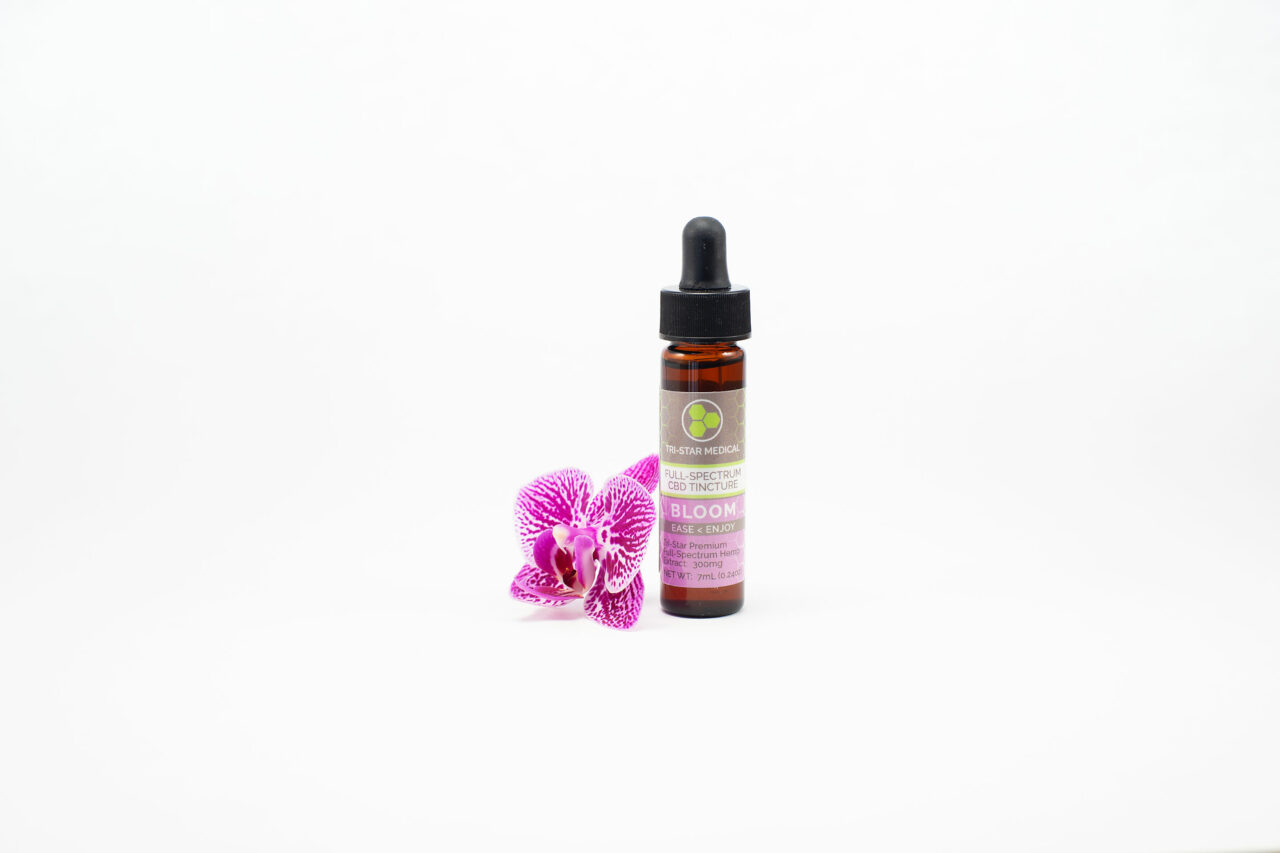 Premium BloomFull-Spectrum CBD Tincture 300mg. Image of bottle with a purple orchid bloom.